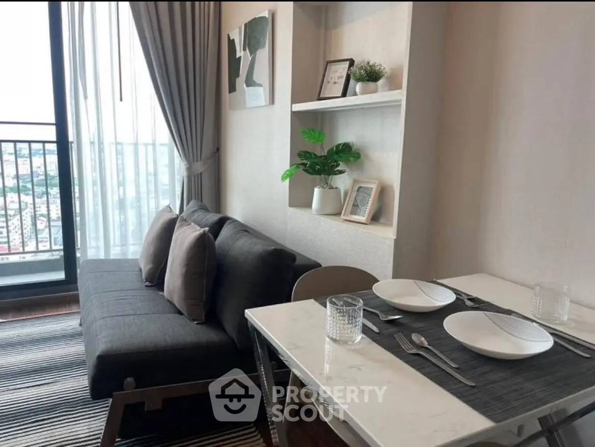 Modern living room with balcony view and stylish dining area