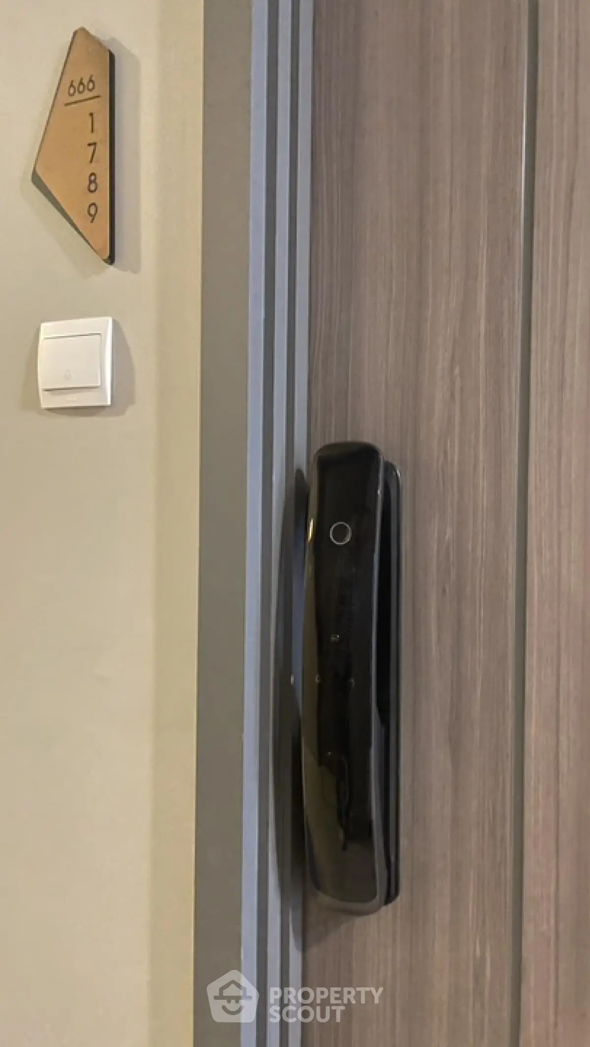 Modern apartment entrance with electronic door lock and stylish design
