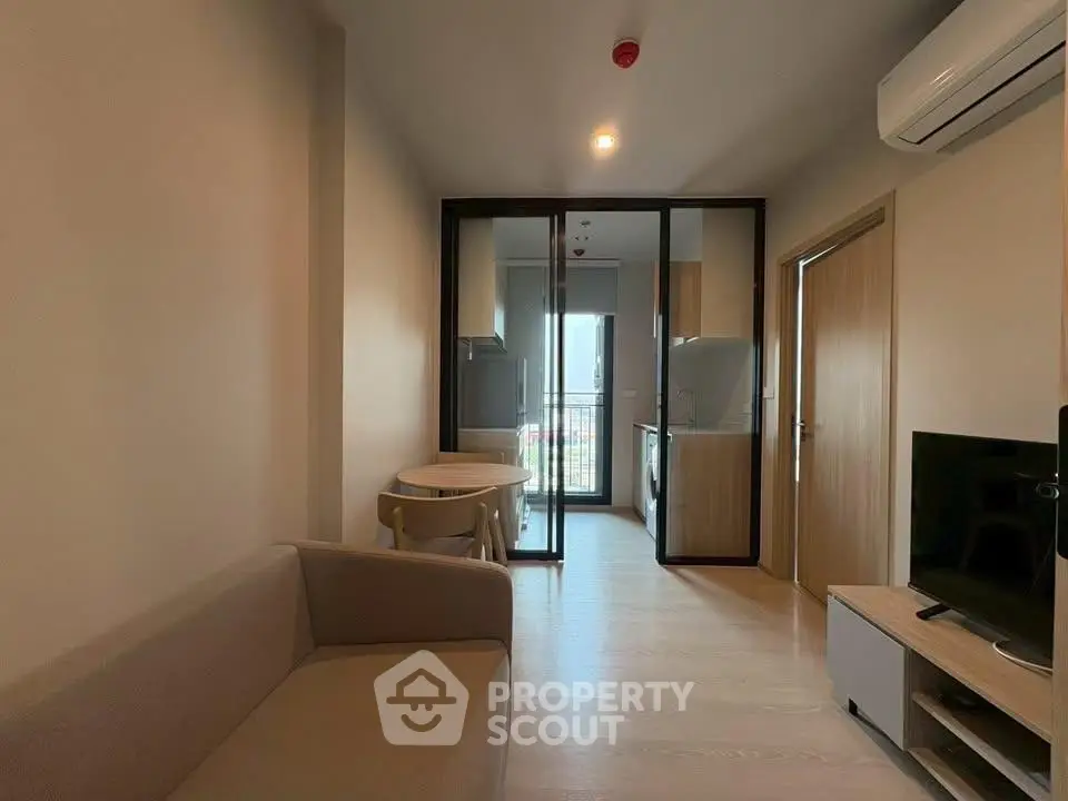 Modern apartment interior with open layout kitchen and cozy living area