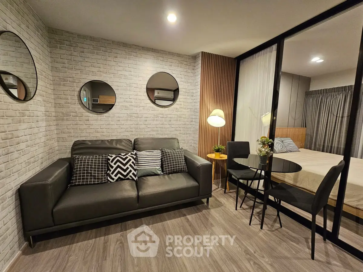 Modern living room with stylish decor and cozy bedroom view