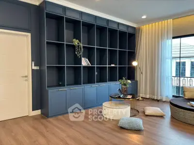 Stylish living room with built-in shelving and cozy seating area