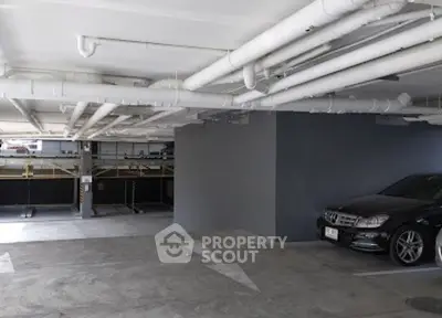 Spacious underground parking area with ample lighting and modern design.