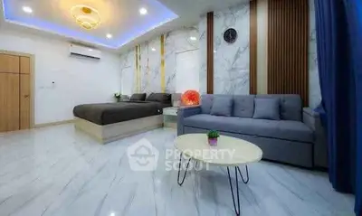 Luxurious modern bedroom with stylish decor and cozy seating area