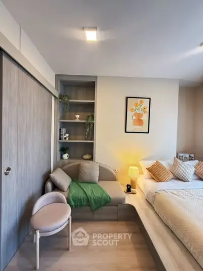 Modern bedroom with cozy seating area and stylish decor