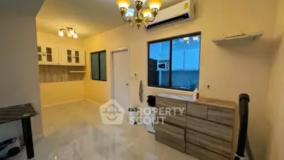 Spacious living room with modern lighting and air conditioning in a stylish apartment.