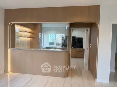 Modern kitchen with open layout and sleek wooden cabinetry