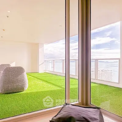 Luxurious balcony with stunning ocean view and modern seating area
