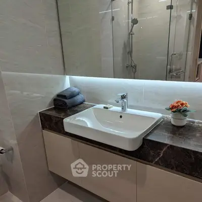 Modern bathroom with sleek sink and elegant marble countertop