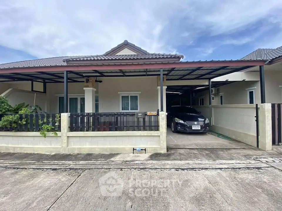 Charming single-story home with carport and modern exterior design in a serene neighborhood.