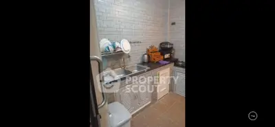 Charming kitchen with modern appliances and sleek cabinetry, perfect for culinary enthusiasts.