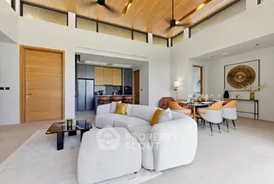 Luxurious open-plan living room with modern furniture and elegant dining area