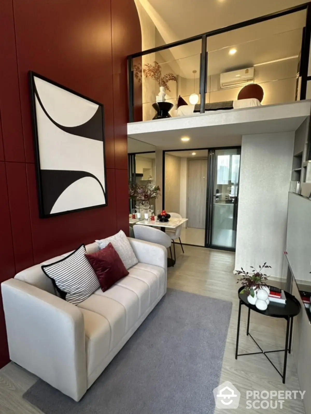 Modern loft apartment with stylish decor and open layout, featuring a cozy living area and mezzanine bedroom.