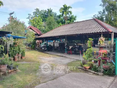 Charming rustic property with open-air pavilion and lush garden, perfect for serene living.