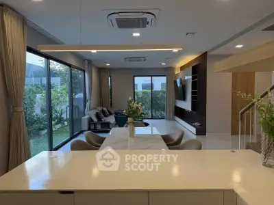 Spacious modern living room with garden view and elegant interior design