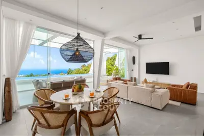 Luxurious open-plan living room with stunning ocean view and modern decor