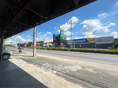 Street view with commercial buildings and clear blue sky