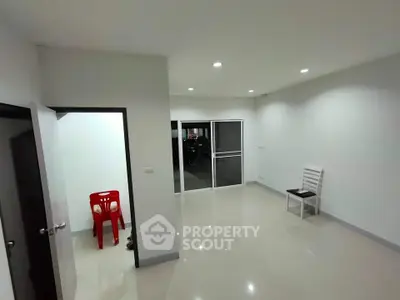 Spacious modern living room with sleek tile flooring and minimalist decor