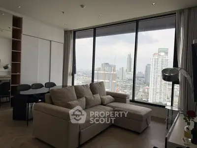 Modern living room with large windows offering stunning city views