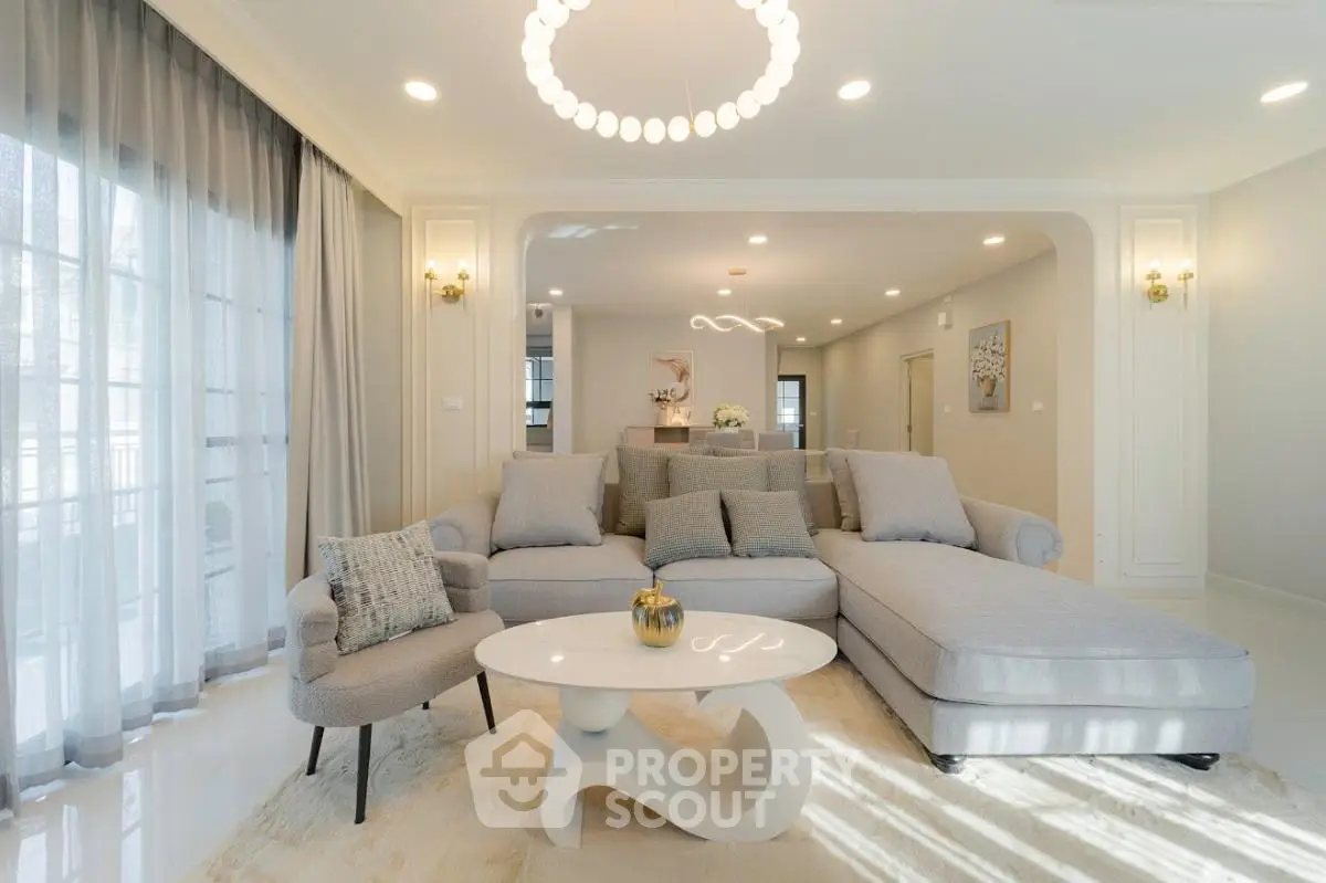 Luxurious living room with elegant decor and modern furniture, featuring a spacious open layout and abundant natural light.