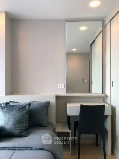 Modern bedroom with sleek design and cozy bedding