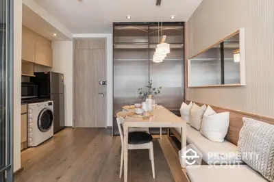 Modern dining area with wooden table and built-in seating in stylish apartment.