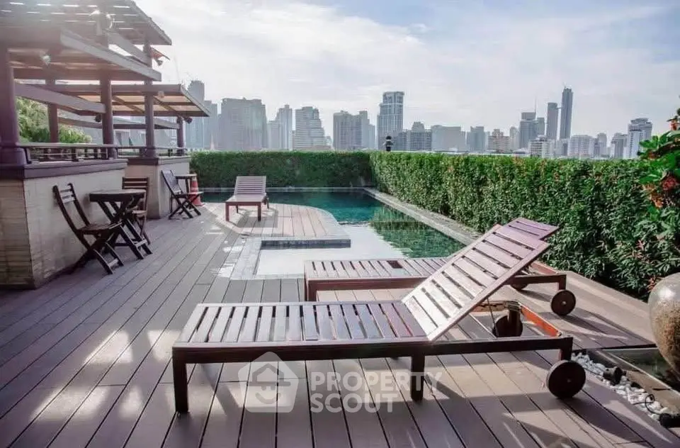 Luxurious rooftop pool with city skyline view and stylish wooden loungers, perfect for relaxation and entertainment.