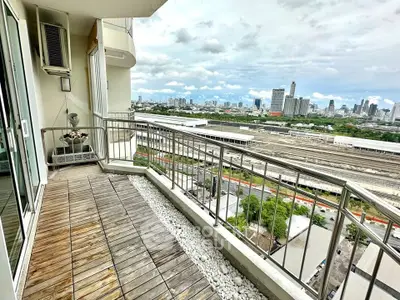 Spacious balcony with stunning city skyline view, perfect for relaxation and enjoying urban living.