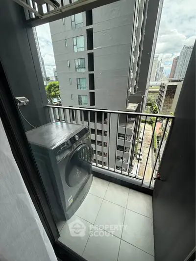 Modern urban balcony with washing machine and city view, perfect for convenient living.