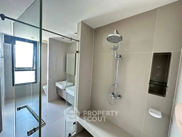 Modern bathroom with glass shower and sleek fixtures