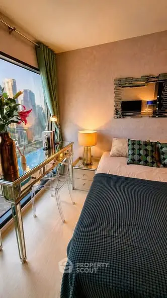 Luxurious bedroom with city view, elegant decor, and stylish furniture in modern apartment.