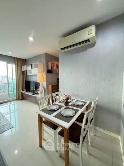 Modern dining area with air conditioning and city view in a stylish apartment.