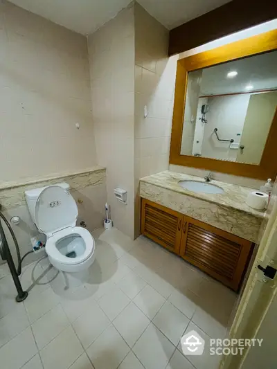 Modern bathroom with elegant marble countertop and spacious layout