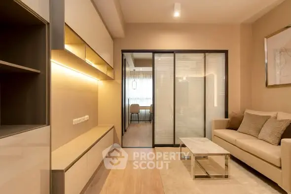 Modern living room with sleek design and cozy seating area