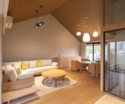 Spacious modern living room with wooden ceiling and stylish furniture