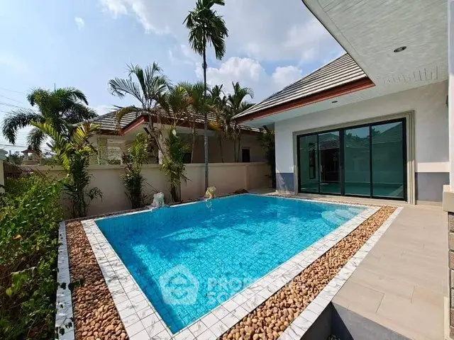 Luxurious villa with private pool and tropical garden, perfect for relaxation and entertaining.