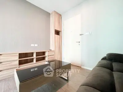 Modern living room with sleek wooden furniture and neutral tones.