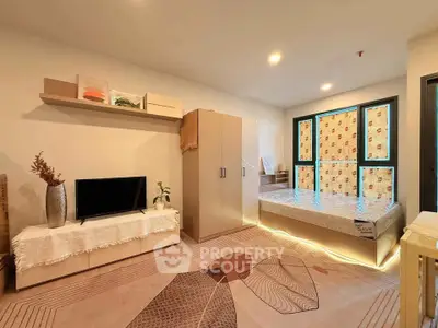 Modern bedroom with stylish decor and natural light