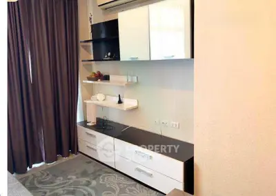 Modern living room with stylish shelving and air conditioning unit, perfect for contemporary living.