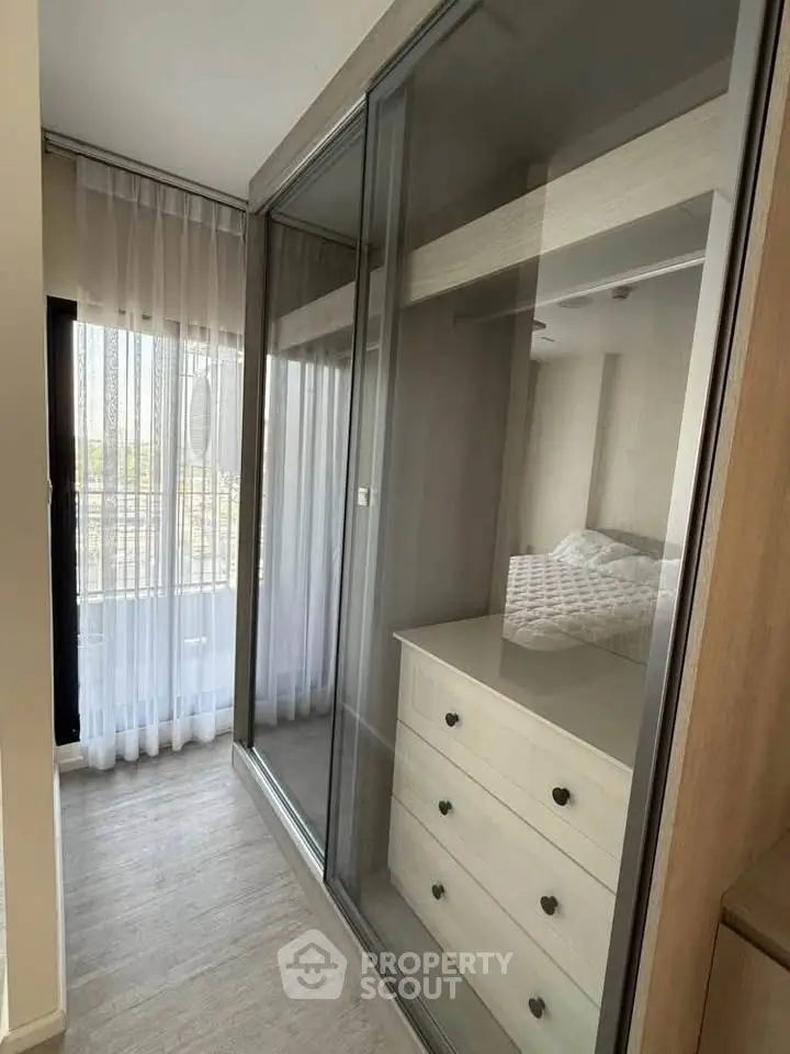 Modern bedroom with sleek sliding closet doors and elegant decor