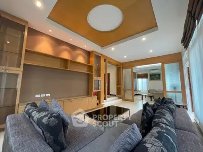Luxurious modern living room with elegant ceiling design and plush seating