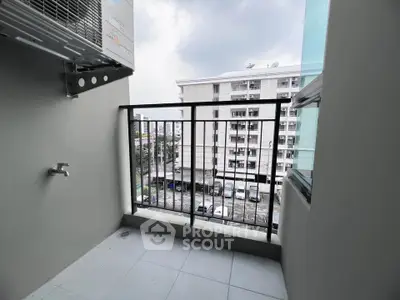 Modern balcony with city view in high-rise apartment