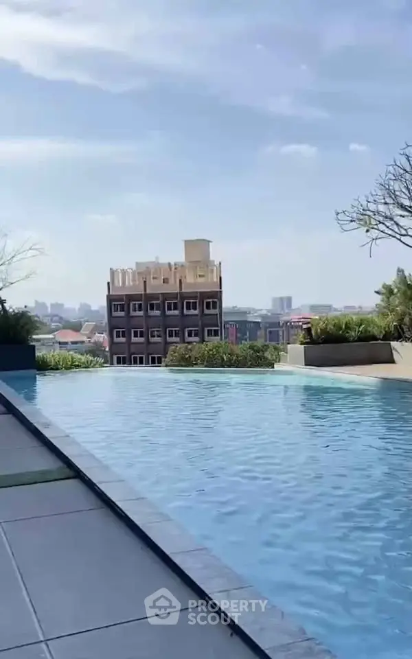 Stunning rooftop pool with cityscape view, perfect for relaxation and leisure.