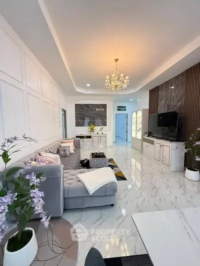 Luxurious living room with elegant chandelier and modern decor