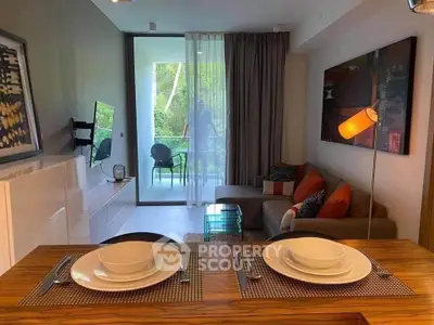Modern living room with stylish decor and balcony view, perfect for urban living.
