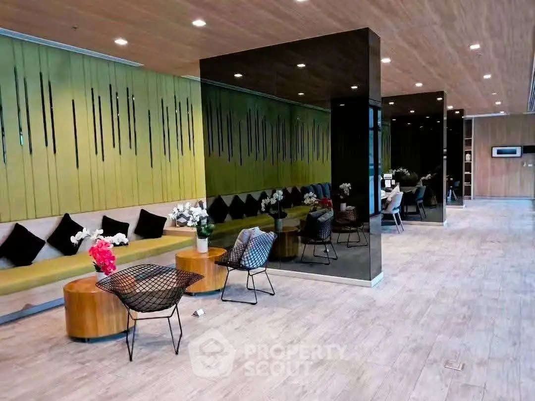 Modern lobby with stylish seating and elegant decor in a contemporary building.