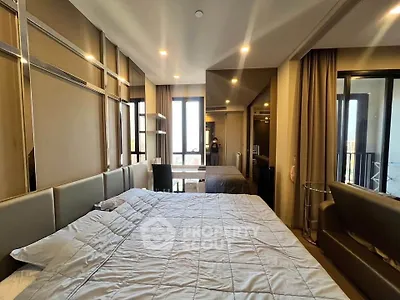 Luxurious bedroom with modern design and ample natural light
