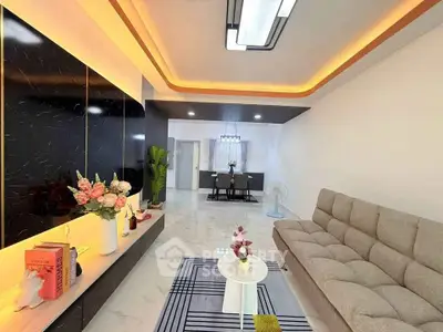 Modern living room with stylish lighting and elegant decor in a contemporary apartment.
