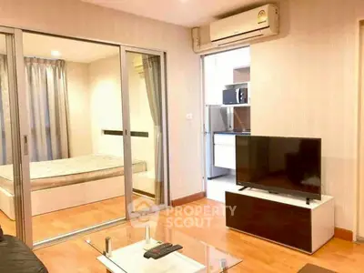 Modern apartment interior with cozy living room and adjacent bedroom