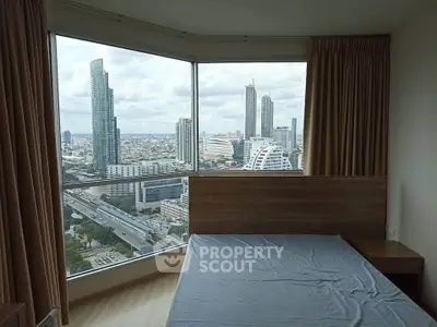 Stunning bedroom with panoramic city view in modern high-rise apartment