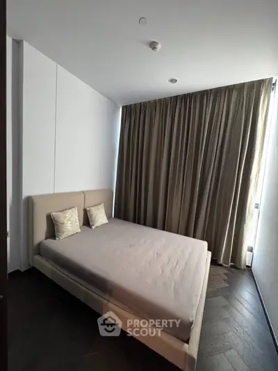 Modern bedroom with minimalist design and elegant curtains